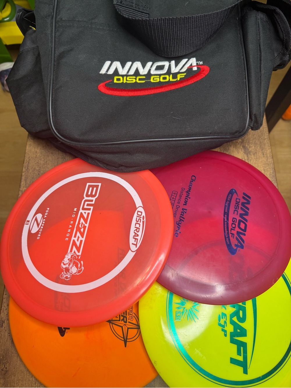 INNOVA Disc Golf Bag with Assorted Discs - Red, Pink, Orange, Yellow Lot